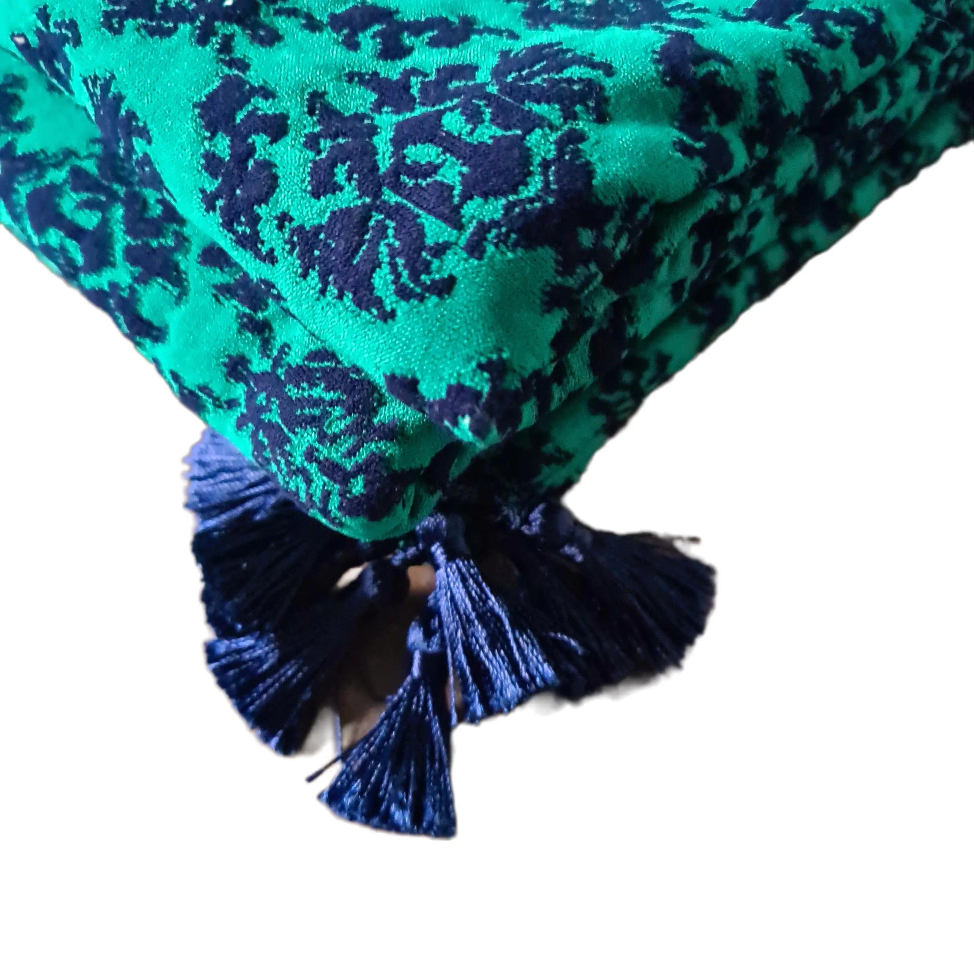 close up of Emerald & Navy Damask Cloque Tasselled Throw 